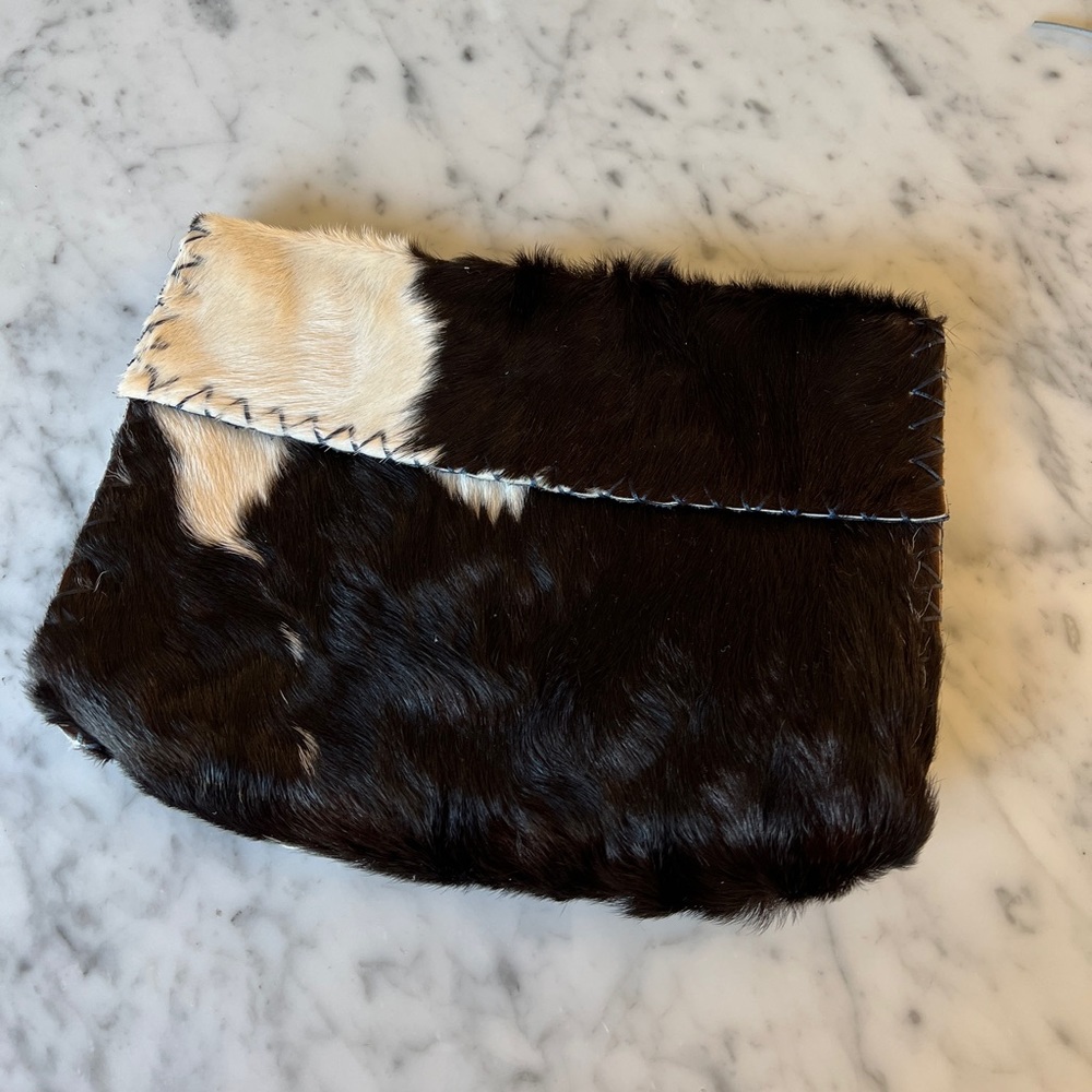 E.R. Leather goods cowhide clutch.